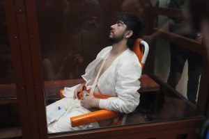 Mukhammadsobir Faizov, one of the four massacre suspects, was brought to court in a wheelchair from a hospital, where he was treated for multiple cuts. (AP)