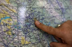 Gen. Masoud Rouzkhosh pointing at Shekari Air Base's location on the map