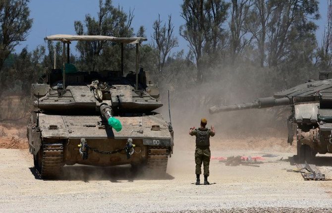 Israeli army tanks take position in southern Israel near the border with the Gaza Strip amid the ongoing conflict between Israel and the Palestinian Hamas movement. (File/AFP)