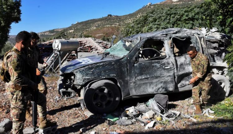 Lebanese army soldiers inspect a damaged vehicle marked “Press” at the site of an Israeli strike that killed some media staff at a guesthouse, where several other reporters were staying, in Hasbaya town, southern Lebanon