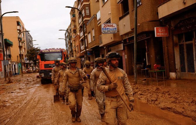 Spanish soldiers prepare to help residents, in the aftermath of floods caused by heavy rains, in Massanassa, near Valencia, Spain,