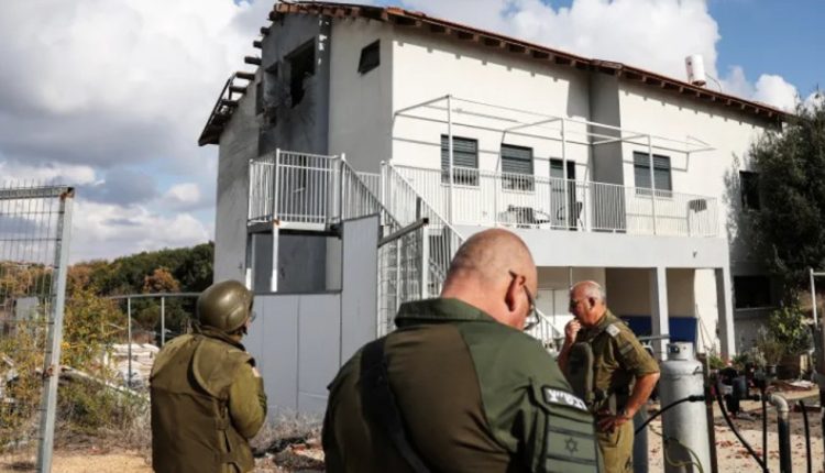 Israeli soldiers gather by a damaged house in the illegal Shtula settlement that has been affected by barrages of projectiles launched from Lebanon towards the Israeli-occupied territories on November 3, 2024. (Photo by Reuters)