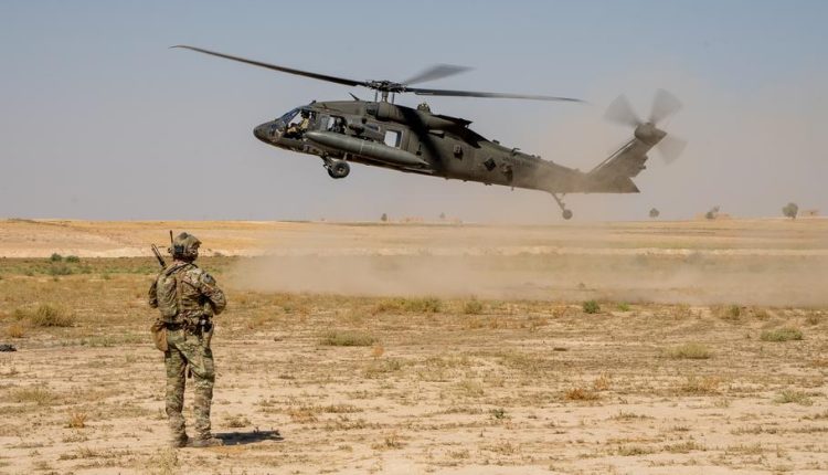 A soldier of the United States military observes the touchdown of a UH-60 Black Hawk helicopter in northeast Syria on October 1, 2024. (Getty Images/U.S. Army)