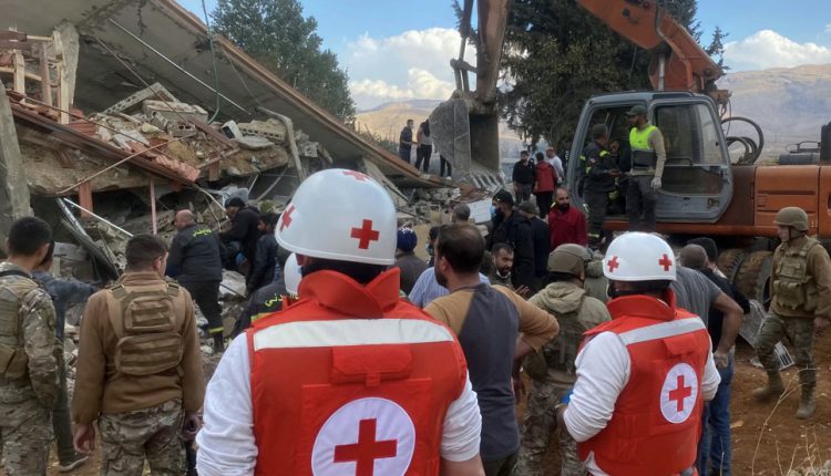 Rescuers from the Lebanese Red Cross and army soldiers gather at the site of an Israeli airstrike in the eastern Lebanese Bekaa valley on November 10, 2024. (AFP)