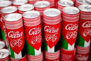 Online, a six-pack of Gaza Cola costs 12 British pounds ($15). For instance, a six-pack of Coke costs around 4.70 pounds ($6).