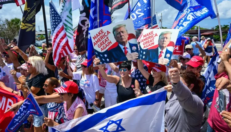 The "Caravan for Trump" event in West Palm Beach, Florida, on June 2, 2024, featured supporters of former US President Donald Trump holding signs and an Israeli flag in favor of the Republican 2024 presidential ticket. AFP/Giorgio Viera