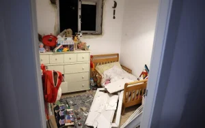 This picture shows debris in a bedroom in Tel Aviv early on December 21, 2024, after a projectile fired from Yemen struck near the building (Jack GUEZ / AFP)