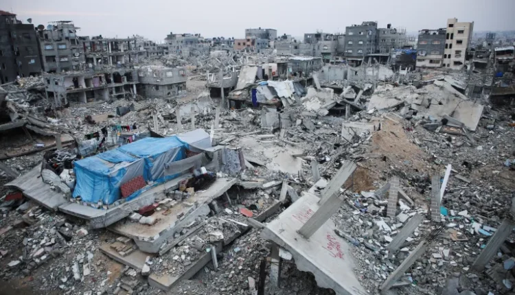 Houses destroyed in previous Israeli strikes lie in ruin in Gaza City on January 16, 2025