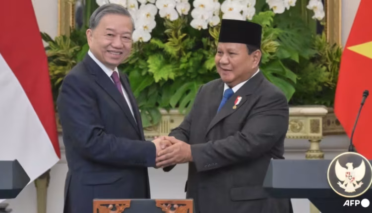 Indonesia's President Prabowo Subianto (right) shakes hands with Vietnam's Communist Party General Secretary To Lam after a joint press conference at the Presidential Palace in Jakarta on Mar 10, 2025.
