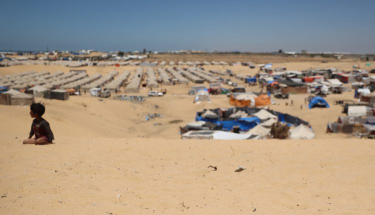 A Palestinian child is seen near a makeshift camp for displaced Palestinians in the area of Tel al-Sultan in Rafah in the southern Gaza