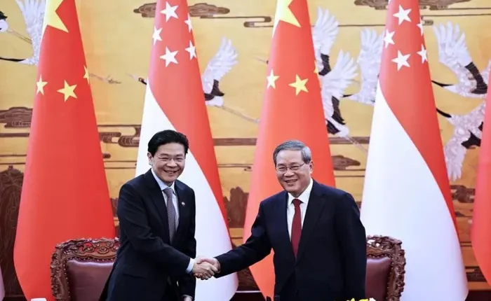 Lawrence Wong meeting Chinese Premier Li Qiang (right) in Beijing on June 23