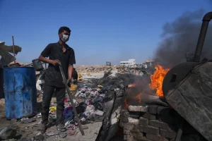 Mohammed Najm prepares a makeshift burner